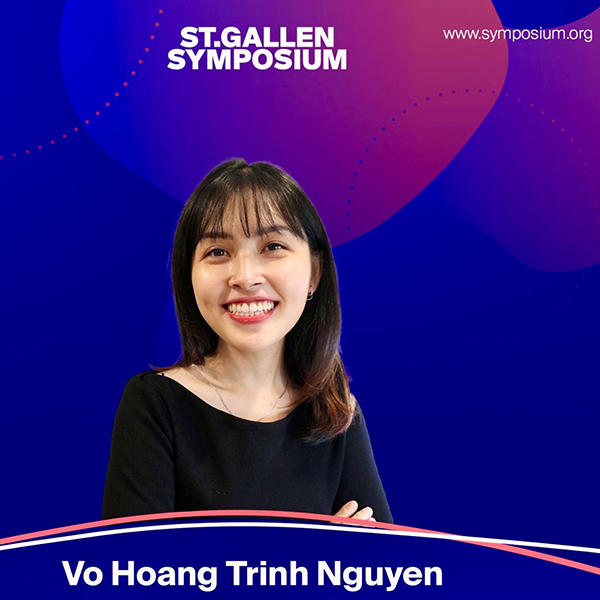 A woman smiles from the middle of a blue poster advertising a symposium.